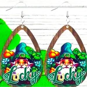 These earrings are adorable gnomes, adorned in a red hat & a mischievous smile.